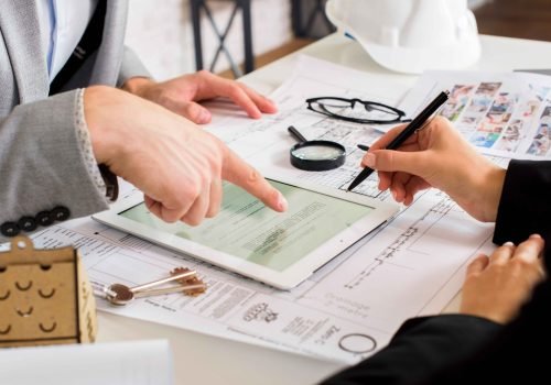 businessmen-analyzing-business-plan-tablet_11zon