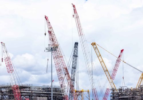 construction-cranes-against-cloudy-sky-at-industri-2026-03-20-04-11-31-utc_11zon