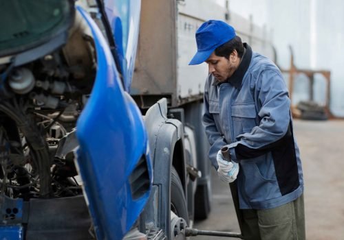full-shot-mechanic-checking-truck_11zon