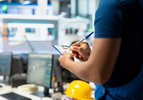 solar-panel-manufacturing-plant-researcher-taking-notes-files_11zon